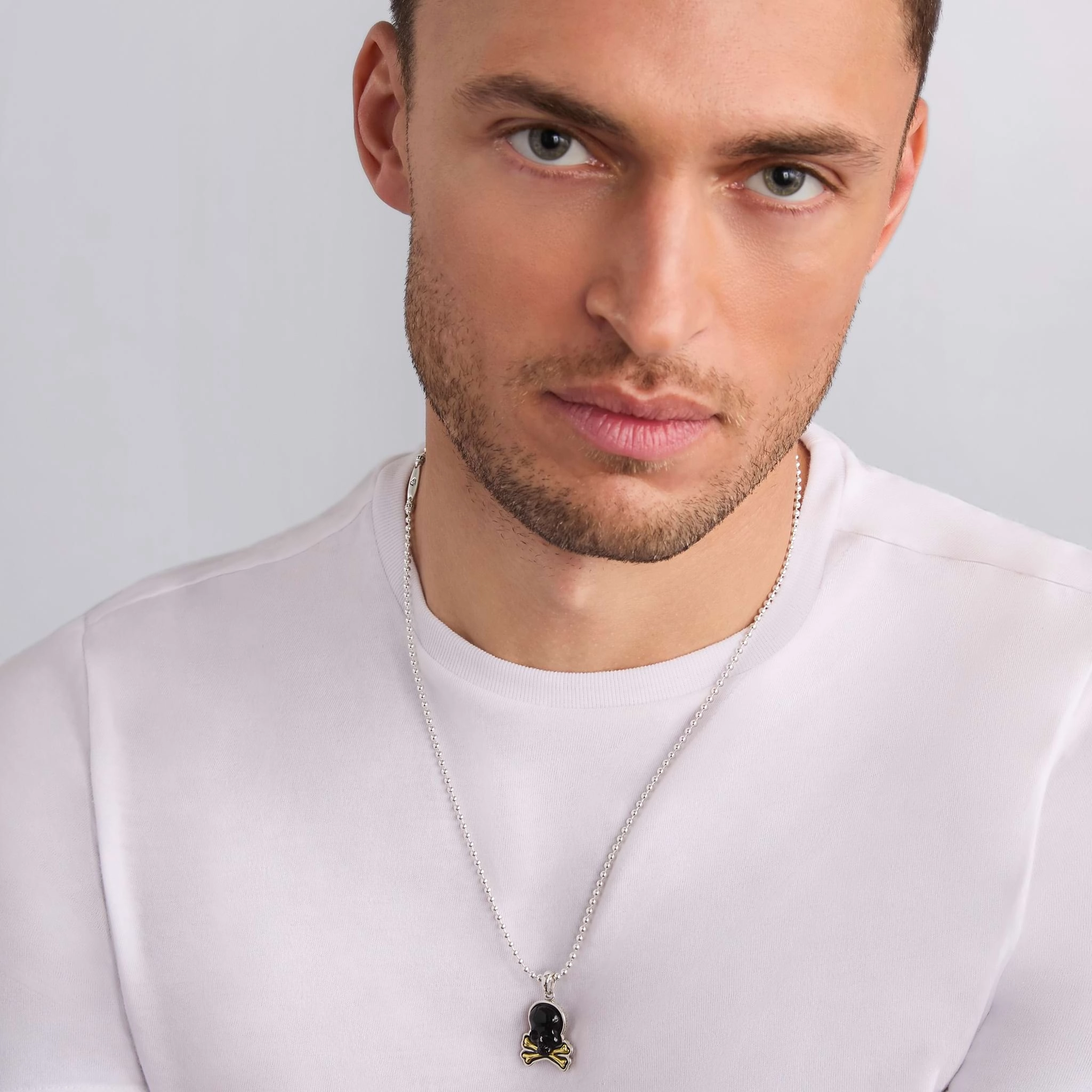 Anthem Two-Tone Black Agate Skull and Bones Amulet