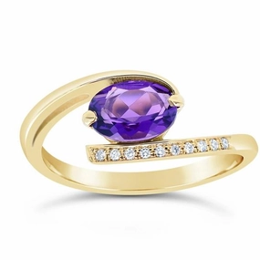 Bague en or jaune sertie d'une Amethyste et de diamants.