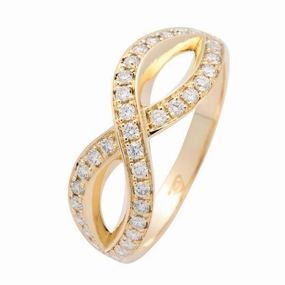 Bague en or jaune sertie de diamants.