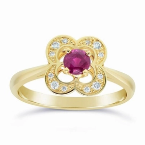 Bague en or jaune sertie de diamants et d'un rubis.
