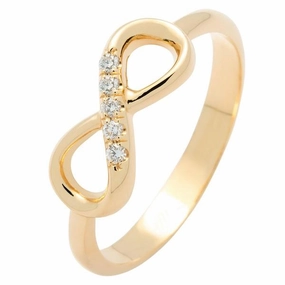 Bague infinity en or jaune sertie de diamants.