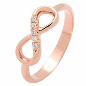 Bague infinity en or rose sertie de diamants.