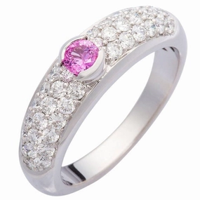 Jonc or blanc sertie d'un saphir et de diamants.