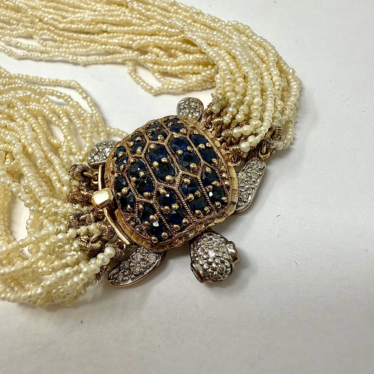 Multistrand Seed Pearl  Necklace with Tortoise Embellished Clasp