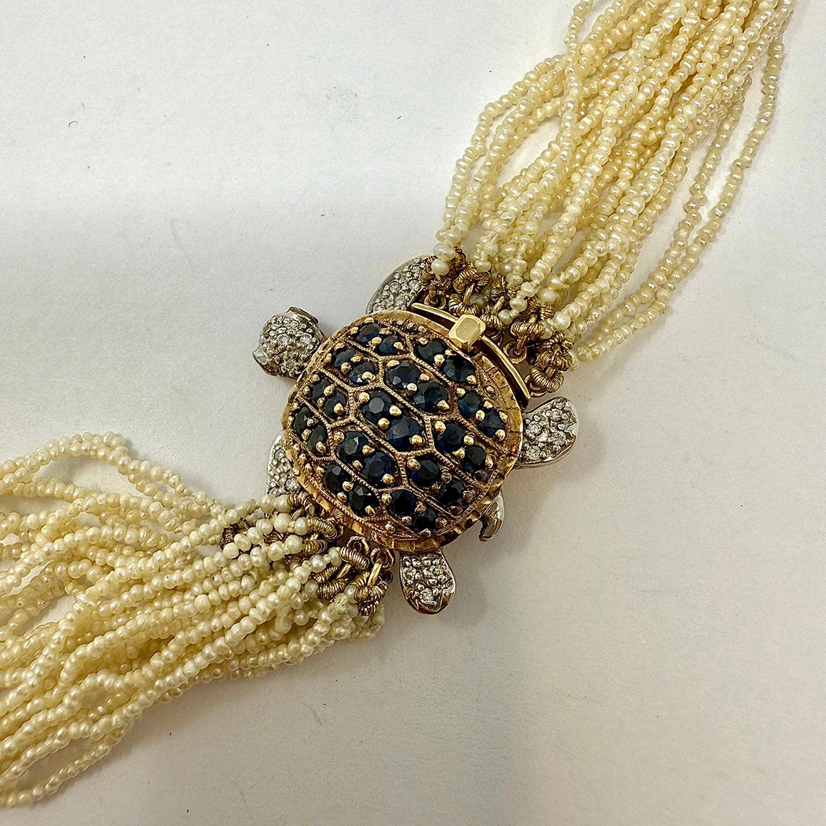 Multistrand Seed Pearl  Necklace with Tortoise Embellished Clasp