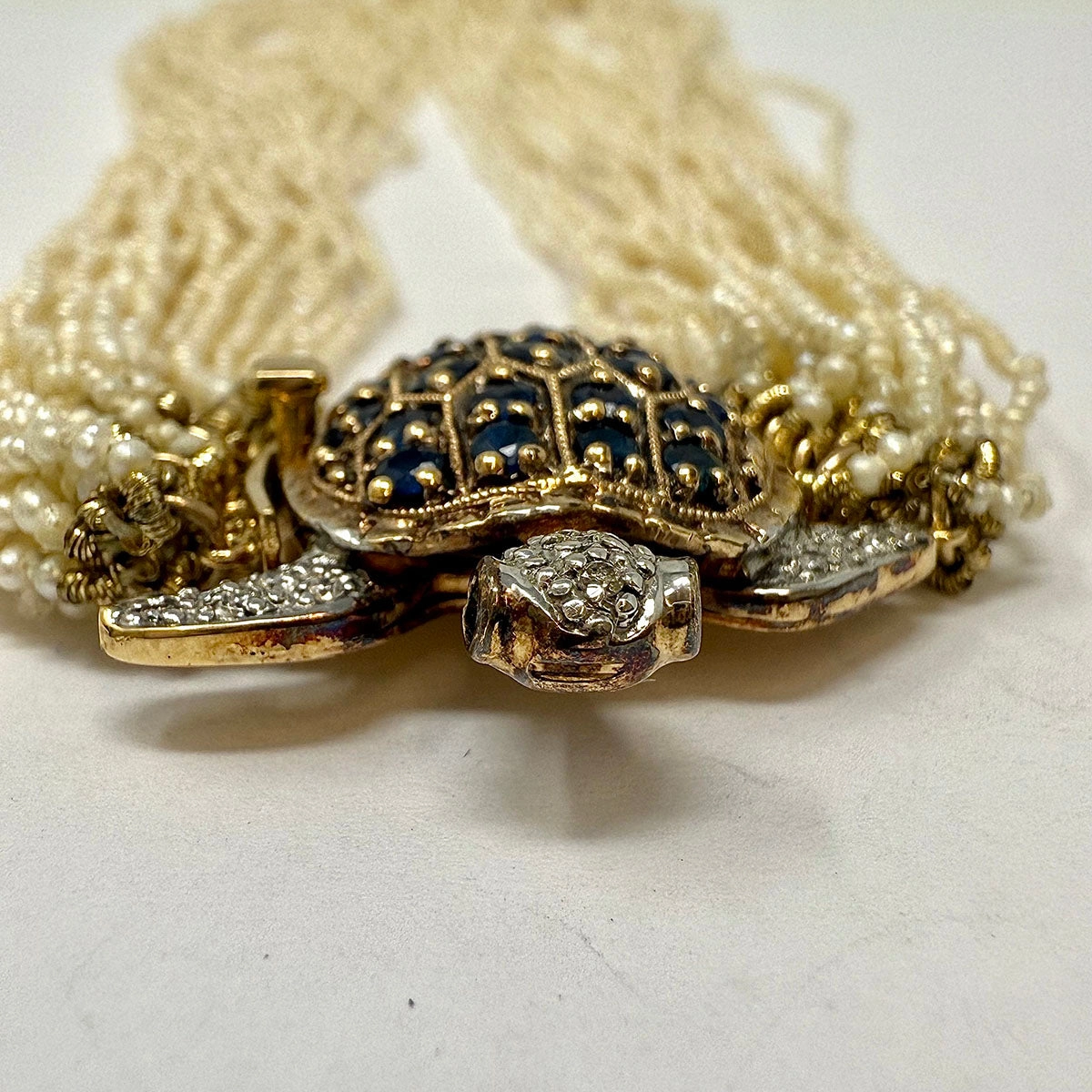 Multistrand Seed Pearl  Necklace with Tortoise Embellished Clasp