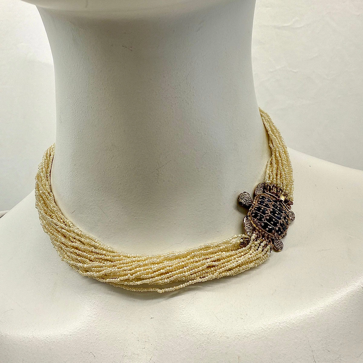Multistrand Seed Pearl  Necklace with Tortoise Embellished Clasp