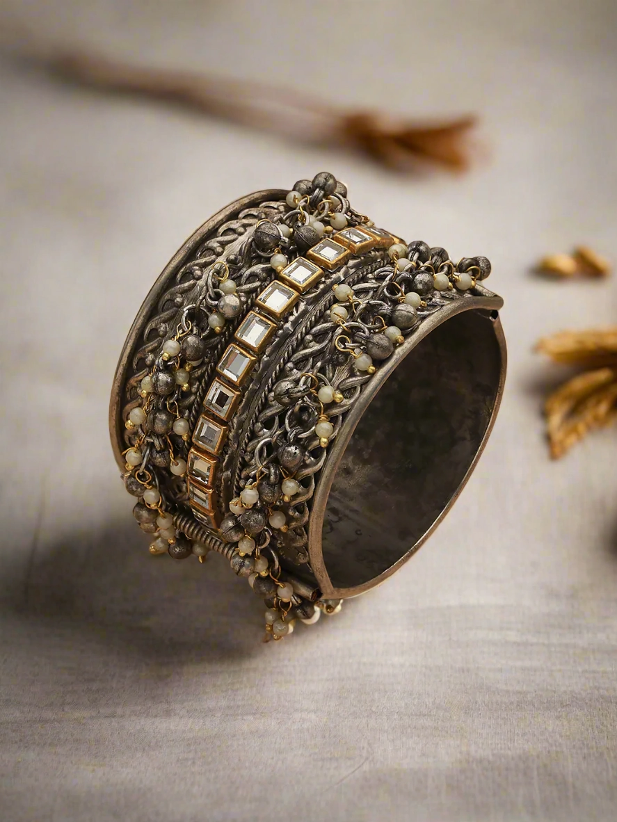 Silver-Plated Oxidised Kundan Studded & Pearl Beaded Bangle-Style Bracelet