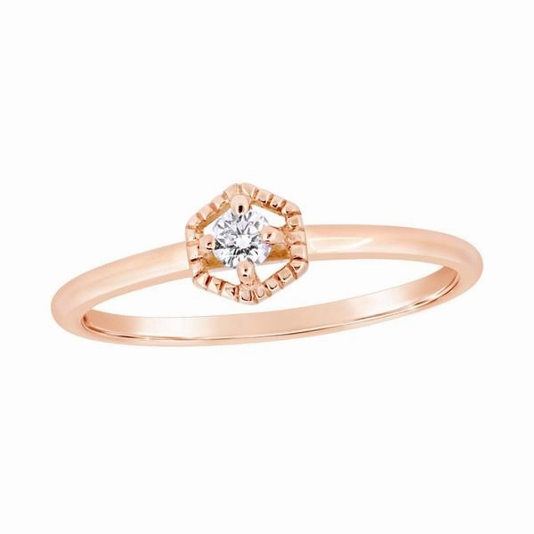 Solitaire en or rose serti d'un diamant.