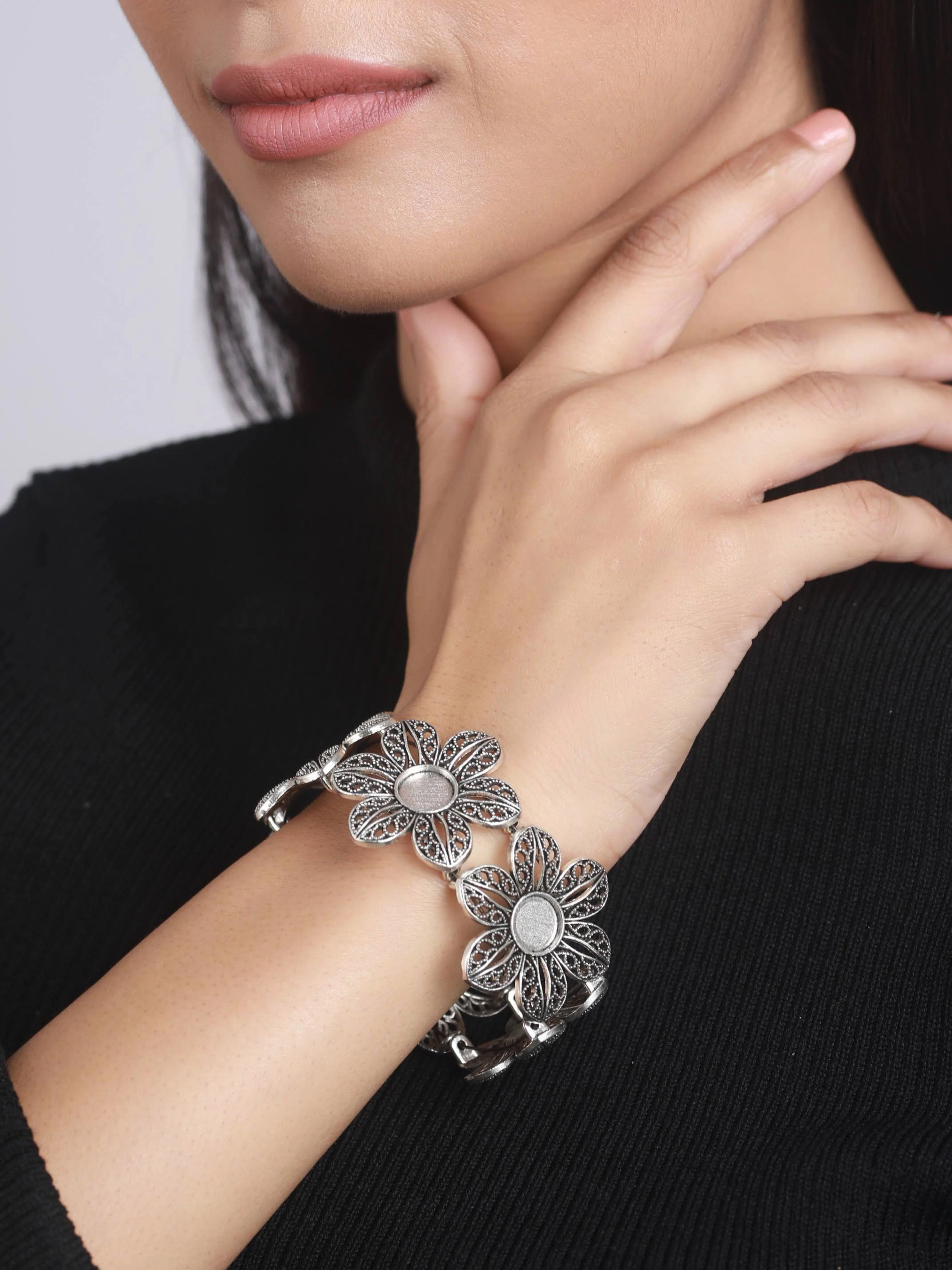 Women Silver-Plated & Floral Style Oxidised Bangle-Style Bracelet